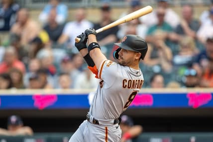 May 22, 2023; Minneapolis, Minnesota, USA; San Francisco Giants right fielder Michael Conforto (8) hits a three-run home run in the first inning against the Minnesota Twins at Target Field. Mandatory Credit: Jesse Johnson-USA TODAY Sports