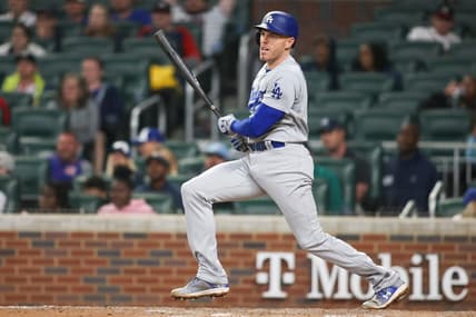 May 22, 2023; Atlanta, Georgia, USA; Los Angeles Dodgers first baseman Freddie Freeman (5) hits a single against the Atlanta Braves in the ninth inning at Truist Park. Mandatory Credit: Brett Davis-USA TODAY Sports