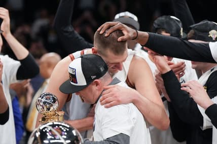 May 22, 2023; Los Angeles, California, USA; Denver Nuggets center Nikola Jokic (15) and head coach Michael Malone celebrate beating the Los Angeles Lakers in game four of the Western Conference Finals for the 2023 NBA playoffs at Crypto.com Arena. Mandatory Credit: Kirby Lee-USA TODAY Sports
