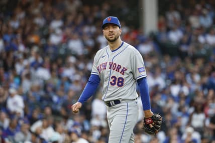 May 23, 2023; Chicago, Illinois, USA; New York Mets starting pitcher Tylor Megill (38) returns to dugout after pitching against the Chicago Cubs during the second inning at Wrigley Field. Mandatory Credit: Kamil Krzaczynski-USA TODAY Sports