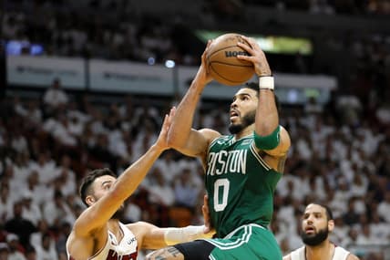 May 23, 2023; Miami, Florida, USA; Boston Celtics forward Jayson Tatum (0) shoots against Miami Heat guard Max Strus (31) in the third quarter during game four of the Eastern Conference Finals for the 2023 NBA playoffs at Kaseya Center. Mandatory Credit: Sam Navarro-USA TODAY Sports