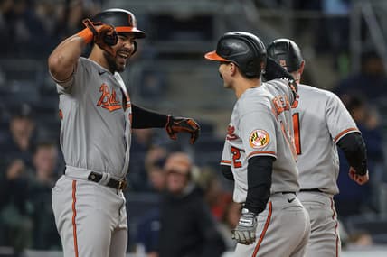 May 24, 2023; Bronx, New York, USA; Baltimore Orioles second baseman Adam Frazier (12) celebrates with right fielder Anthony Santander (25) after hitting a three run home run during the seventh inning against the New York Yankees at Yankee Stadium. Mandatory Credit: Vincent Carchietta-USA TODAY Sports