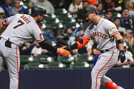 May 25, 2023; Milwaukee, Wisconsin, USA; San Francisco Giants right fielder Michael Conforto (8) is greeted by third baseman J.D. Davis (7) after hitting a solo home run in the eighth inning against the Milwaukee Brewers at American Family Field. Mandatory Credit: Benny Sieu-USA TODAY Sports