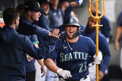 May 25, 2023; Seattle, Washington, USA; Seattle Mariners first baseman Ty France (23) celebrates in the dugout after hitting a home run against the Oakland Athletics during the sixth inning at T-Mobile Park. Mandatory Credit: Steven Bisig-USA TODAY Sports