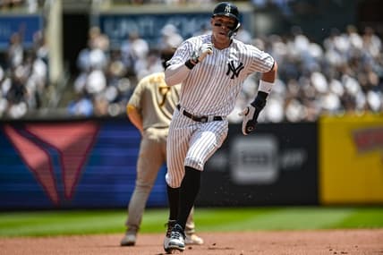 May 27, 2023; Bronx, New York, USA; New York Yankees center fielder Aaron Judge (99) advances to third base on a single by New York Yankees first baseman Anthony Rizzo (48) during the first inning against the San Diego Padres at Yankee Stadium. Mandatory Credit: John Jones-USA TODAY Sports