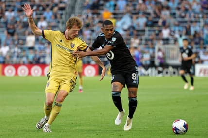May 27, 2023; Saint Paul, Minnesota, USA; Real Salt Lake midfielder Bode Hidalgo (19) battles for the ball against Minnesota United midfielder Joseph Rosales (8) during the first half lat Allianz Field. Mandatory Credit: Matt Krohn-USA TODAY Sports