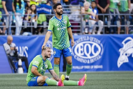 May 27, 2023; Seattle, Washington, USA; Seattle Sounders FC midfielder Alex Roldan (16) consoles forward Jordan Morris (13, bottom) following an injury to Morris during the first half against the New York Red Bulls at Lumen Field. Mandatory Credit: Joe Nicholson-USA TODAY Sports
