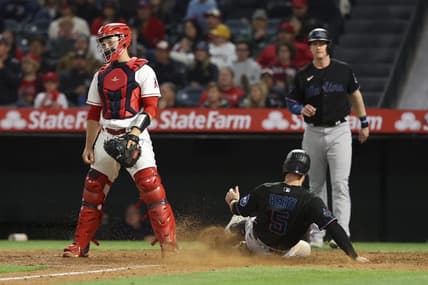May 27, 2023; Anaheim, California, USA;  Jon Berti (5) slides safely into home plate to score on an RBI single by Garrett Hampson (1) during the tenth inning of a game against the Los Angeles Angels at Angel Stadium. Mandatory Credit: Jessica Alcheh-USA TODAY Sports