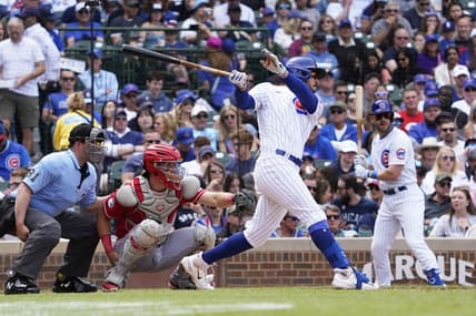 May 28, 2023; Chicago, Illinois, USA; Chicago Cubs center fielder Mike Tauchman (40) hits a single against the Cincinnati Reds during the fourth inning at Wrigley Field. Mandatory Credit: David Banks-USA TODAY Sports