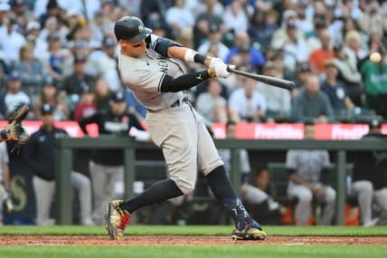 May 29, 2023; Seattle, Washington, USA; New York Yankees right fielder Aaron Judge (99) hits a two-run home run against the Seattle Mariners during the third inning at T-Mobile Park. Mandatory Credit: Steven Bisig-USA TODAY Sports