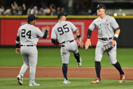 May 29, 2023; Seattle, Washington, USA; New York Yankees designated hitter Willie Calhoun (24) and third baseman Oswaldo Cabrera (95), and right fielder Aaron Judge (99) celebrate defeating the Seattle Mariners at T-Mobile Park. Mandatory Credit: Steven Bisig-USA TODAY Sports