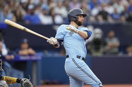 May 30, 2023; Toronto, Ontario, CAN; Toronto Blue Jays designated hitter Brandon Belt (13) hits an RBI single against the Milwaukee Brewers during the second inning at Rogers Centre. Mandatory Credit: John E. Sokolowski-USA TODAY Sports
