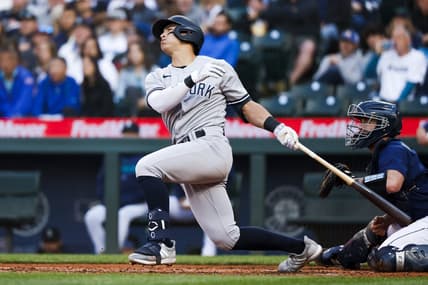 May 30, 2023; Seattle, Washington, USA; New York Yankees shortstop Anthony Volpe (11) hits a three-run home run against the Seattle Mariners during the third inning at T-Mobile Park. Mandatory Credit: Joe Nicholson-USA TODAY Sports