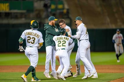 May 30, 2023; Oakland, California, USA;  Oakland Athletics third baseman Jonah Bride (26) and designated hitter Ramon Laureano (22) and catcher Shea Langeliers (23) and teammates celebrate after the game against the Atlanta Braves[ at Oakland-Alameda County Coliseum. Mandatory Credit: Neville E. Guard-USA TODAY Sports