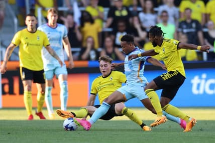 May 31, 2023; Columbus, Ohio, USA; Colorado Rapids forward Jonathan Lewis (7) dribbles the ball against the Columbus Crew SC midfielder Aidan Morris (8) and Columbus Crew SC defender Steven Moreira (31) at Lower.com Field. Mandatory Credit: Trevor Ruszkowski-USA TODAY Sports