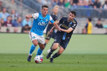 May 31, 2023; Chester, Pennsylvania, USA; Charlotte FC midfielder Ashley Westwood (8) controls the ball against Philadelphia Union midfielder Leon Flach (31) in the first half at Subaru Park. Mandatory Credit: Mitchell Leff-USA TODAY Sports
