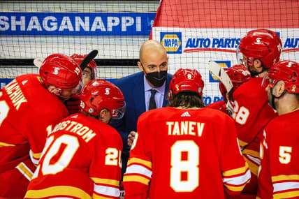 Mar 27, 2021; Calgary, Alberta, CAN; Calgary Flames assistant Coach Ryan Huska on his bench against the Winnipeg Jets during the third period at Scotiabank Saddledome. Mandatory Credit: Sergei Belski-USA TODAY Sports