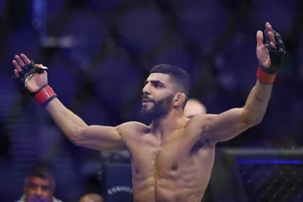 Aug 20, 2022; Salt Lake City, Utah, USA; Amir Albazi (red gloves) reacts after defeating Francisco Figueiredo (blue gloves) during UFC 278 at Vivint Arena. Mandatory Credit: Jeffrey Swinger-USA TODAY Sports
