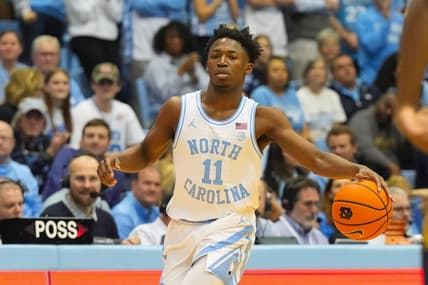 Jan 7, 2023; Chapel Hill, North Carolina, USA;  North Carolina Tar Heels guard D'Marco Dunn (11) dribbles the ball against the Notre Dame Fighting Irish during the second half at Dean E. Smith Center. Mandatory Credit: James Guillory-USA TODAY Sports