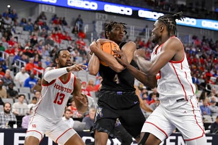 Mar 12, 2023; Fort Worth, TX, USA; Memphis Tigers forward Chandler Lawson (4) grabs a rebound in front of Houston Cougars forward J'Wan Roberts (13) and forward Jarace Walker (25) during the first half at Dickies Arena. Mandatory Credit: Jerome Miron-USA TODAY Sports