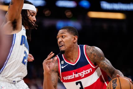 Mar 21, 2023; Orlando, Florida, USA; Washington Wizards guard Bradley Beal (3) dribbles the ball past Orlando Magic guard Markelle Fultz (20) during the second half at Amway Center. Mandatory Credit: Rich Storry-USA TODAY Sports