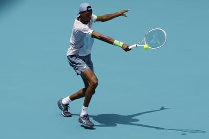 Mar 30, 2023; Miami, Florida, US; Christopher Eubanks (USA) hits a backhand against Daniil Medvedev (not pictured) in a men's singles quarterfinal in the Miami Open at Hard Rock Stadium. Mandatory Credit: Geoff Burke-USA TODAY Sports