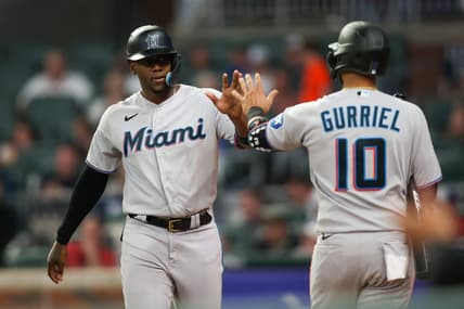 Apr 25, 2023; Atlanta, Georgia, USA; Miami Marlins designated hitter Jorge Soler (12) celebrates after scoring with first baseman Yuli Gurriel (10) against the Atlanta Braves in eighth inning at Truist Park. Mandatory Credit: Brett Davis-USA TODAY Sports
