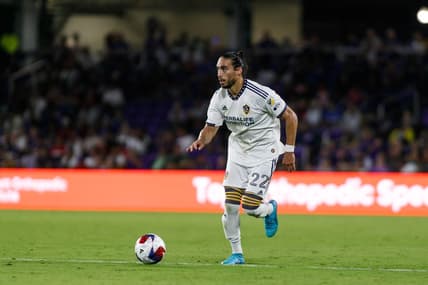 Apr 29, 2023; Orlando, Florida, USA; Los Angeles Galaxy defender Martin Caceres (22) dribbles the ball into Orlando City SC   s half in the second half at Exploria Stadium. Mandatory Credit: Morgan Tencza-USA TODAY Sports