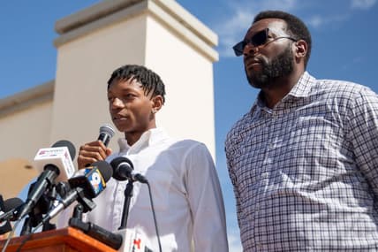 Deuce Benjamin, left, tears up while speaking in May about the alleged assault he faced while playing for NMSU. The two former NMSU players settled a suit against New Mexico State University, two former coaches and three former players.

Nmsu Lawsuit Presser