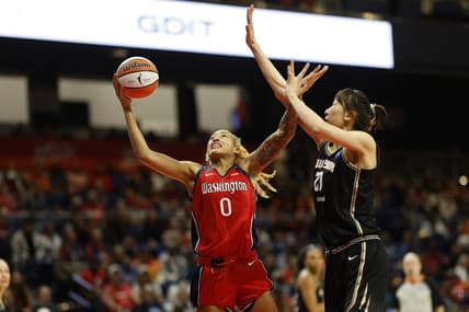 May 19, 2023; Washington, District of Columbia, USA; Washington Mystics center Shakira Austin (0) shoots the ball as New York Liberty center Han Xu (21) defends at Entertainment & Sports Arena. Mandatory Credit: Geoff Burke-USA TODAY Sports