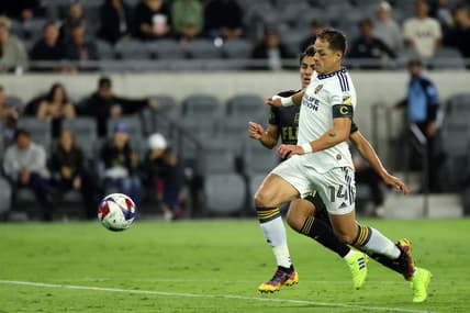 May 23, 2023; Los Angeles, CA, USA;  Los Angeles Galaxy forward Javier Hernandez (14) and Los Angeles FC defender Diego Rosales (43) battle for the ball during the first half at BMO Stadium. Mandatory Credit: Kiyoshi Mio-USA TODAY Sports