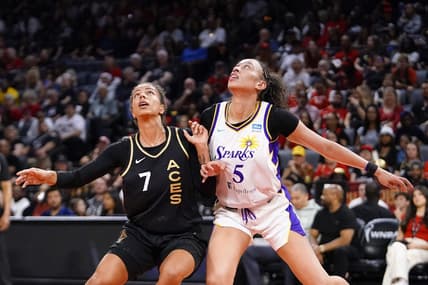 May 27, 2023; Las Vegas, Nevada, USA; Los Angeles Sparks forward Dearica Hamby (5) battles for position against Las Vegas Aces forward Alysha Clark (7) during the first quarter at Michelob Ultra Arena. Mandatory Credit: Lucas Peltier-USA TODAY Sports