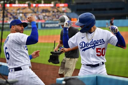 May 31, 2023; Los Angeles, California, USA; Los Angeles Dodgers right fielder Mookie Betts (50) celebrates his solo home run against the Washington Nationals with left fielder David Peralta (6) during the eighth inning at Dodger Stadium. Mandatory Credit: Gary A. Vasquez-USA TODAY Sports