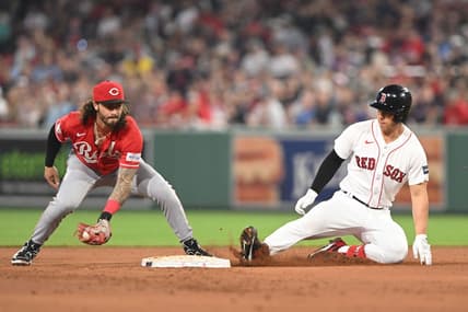 May 31, 2023; Boston, Massachusetts, USA; Boston Red Sox left fielder Rob Refsnyder (30) slides safely into second base ahead of a tag by Cincinnati Reds second baseman Jonathan India (6) during the sixth inning at Fenway Park. Mandatory Credit: Brian Fluharty-USA TODAY Sports