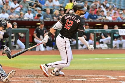 May 31, 2023; Phoenix, Arizona, USA;  Arizona Diamondbacks left fielder Lourdes Gurriel Jr. (12) hits a two RBI single in the first inning against the Colorado Rockies at Chase Field. Mandatory Credit: Matt Kartozian-USA TODAY Sports