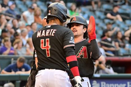 May 31, 2023; Phoenix, Arizona, USA;  Arizona Diamondbacks left fielder Corbin Carroll (7) celebrates with second baseman Ketel Marte (4) after scoring in the first inning against the Colorado Rockies at Chase Field. Mandatory Credit: Matt Kartozian-USA TODAY Sports
