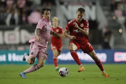 May 31, 2023; Fort Lauderdale, Florida, USA; Inter Miami midfielder Robert Taylor (16) battles for ball possession against New York Red Bulls forward Tom Barlow (74) during the second half at DRV PNK Stadium. Mandatory Credit: Sam Navarro-USA TODAY Sports