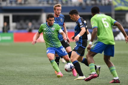 May 31, 2023; Seattle, Washington, USA; Seattle Sounders midfielder Nicolas Lodeiro (10) and San Jose Earthquakes forward Cristian Espinoza (10) fight for the ball during the first half at Lumen Field. Mandatory Credit: Steven Bisig-USA TODAY Sports