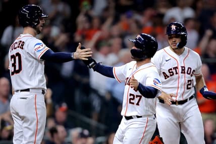 Jun 1, 2023; Houston, Texas, USA; Houston Astros second baseman Jose Altuve (27) is greeted by Houston Astros right fielder Kyle Tucker (30) after scoring a run against the Los Angeles Angels during the fifth inning at Minute Maid Park. Mandatory Credit: Erik Williams-USA TODAY Sports
