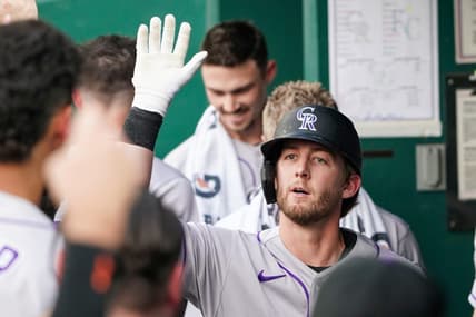 Jun 2, 2023; Kansas City, Missouri, USA; Colorado Rockies third baseman Ryan McMahon (24) is congratulated in the dugout against the Kansas City Royals after his solo home run in the first inning at Kauffman Stadium. Mandatory Credit: Denny Medley-USA TODAY Sports