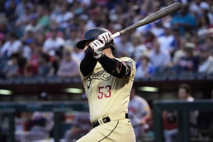 Jun 2, 2023; Phoenix, Arizona, USA; Arizona Diamondbacks first baseman Christian Walker (53) hits an RBI double against the Atlanta Braves during the third inning at Chase Field. Mandatory Credit: Joe Camporeale-USA TODAY Sports