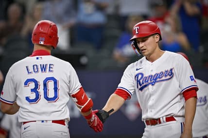 Jun 3, 2023; Arlington, Texas, USA; Texas Rangers first baseman Nathaniel Lowe (30) and shortstop Corey Seager (5) celebrate after Lowe hits a two run home run during the seventh inning against the Seattle Mariners at Globe Life Field. Mandatory Credit: Jerome Miron-USA TODAY Sports