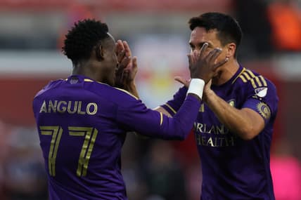 Jun 3, 2023; Harrison, New Jersey, USA; Orlando City forward Ivan Angulo (77) celebrates with Orlando City midfielder Mauricio Pereyra (10) after scoring a goal during the first half at Red Bull Arena. Mandatory Credit: Vincent Carchietta-USA TODAY Sports