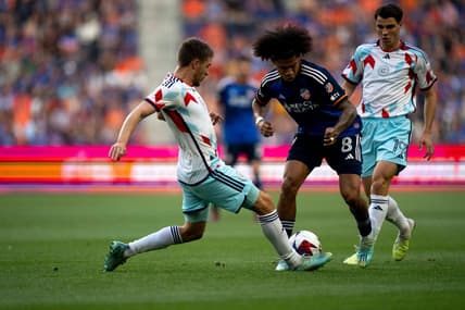 Chicago Fire forward Georgios Koutsias (19) kicks the ball away from FC Cincinnati midfielder Marco Angulo (8) in the first half of the MLS match at TQL Stadium in Cincinnati on Saturday, June 3, 2023.
