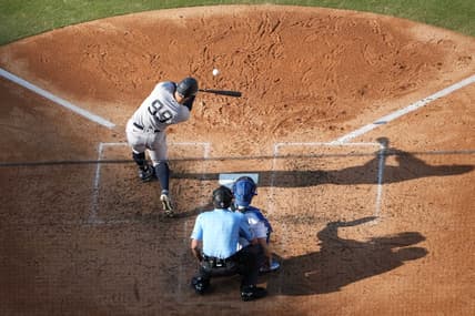 Jun 3, 2023; Los Angeles, California, USA; New York Yankees right fielder Aaron Judge (99) follows through on a home run in the sixth inning as Los Angeles Dodgers catcher Will Smith (16) and home plate umpire John Tumpane (74) watch at Dodger Stadium. Mandatory Credit: Kirby Lee-USA TODAY Sports
