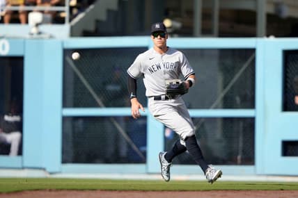 Jun 3, 2023; Los Angeles, California, USA; New York Yankees right fielder Aaron Judge (99) fields the ball on a single by Los Angeles Dodgers catcher Will Smith (not pictured) in the fourth inning at Dodger Stadium. Mandatory Credit: Kirby Lee-USA TODAY Sports