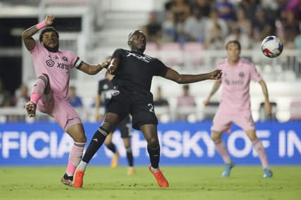 Jun 3, 2023; Fort Lauderdale, Florida, USA; D.C. United forward Christian Benteke (20) shoots the ball against Inter Miami midfielder Dixon Arroyo (2) during the second half at DRV PNK Stadium. Mandatory Credit: Sam Navarro-USA TODAY Sports