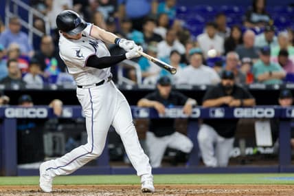 Jun 4, 2023; Miami, Florida, USA; Miami Marlins designated hitter Garrett Cooper (26) hits a three-run home run against the Oakland Athletics during the fifth inning at loanDepot Park. Mandatory Credit: Sam Navarro-USA TODAY Sports