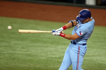 Jun 4, 2023; Arlington, Texas, USA; Texas Rangers first baseman Nathaniel Lowe (30) singles in the third inning against the Seattle Mariners at Globe Life Field. Mandatory Credit: Tim Heitman-USA TODAY Sports