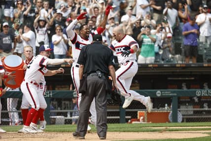 Jun 4, 2023; Chicago, Illinois, USA; Chicago White Sox third baseman Jake Burger (30) celebrates with teammates as he crosses home plate after hitting a grand slam walk-off against the Detroit Tigers during the ninth inning at Guaranteed Rate Field. Mandatory Credit: Kamil Krzaczynski-USA TODAY Sports